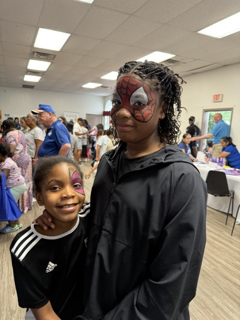 Jacqueline Clarke with children at community event